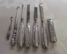 Silver handled manicure items, button hooks & cigarette holder