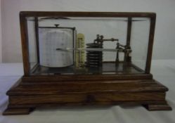 Barograph in an oak & bevel glass case