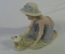 Nao figurine of a young girl with dove
