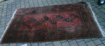 Old red ground rug 2.46m x 1.42m