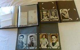 3 albums of old movie star photographs including signed photos by Errol Flynn, Leslie Howard & Barry