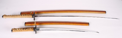 A pair of modern Japanese swords in lacquered scabbards, blades 29"" and 19"" long