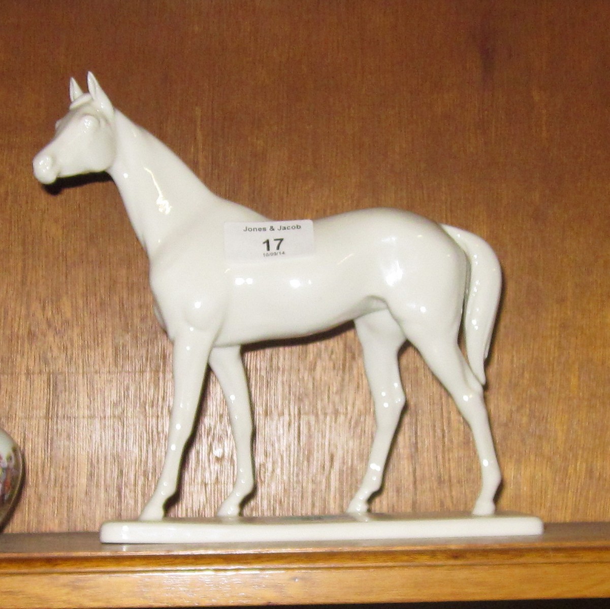 A Nymphenburg white figure of a walking horse, impressed shield mark, 7 3/4"" high