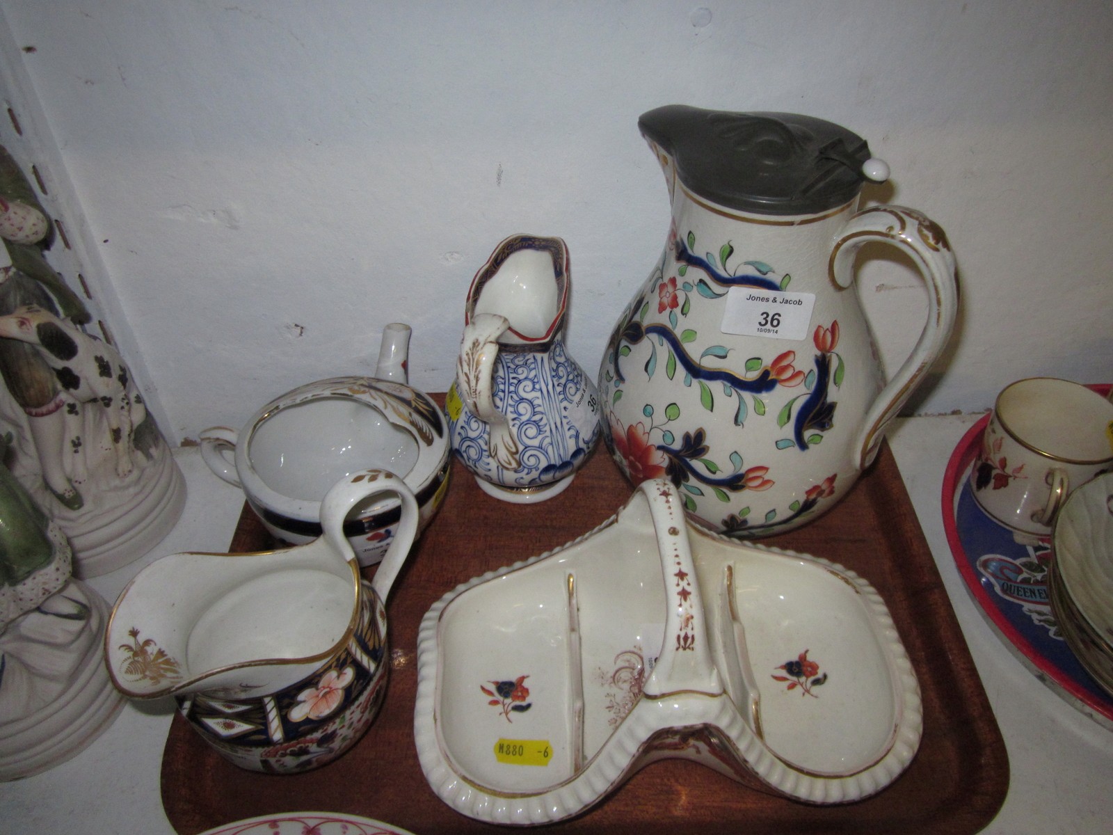 A Bloor Derby Imari decorated jug, another Imari decorated jug, a similar jug, an infant feeder and