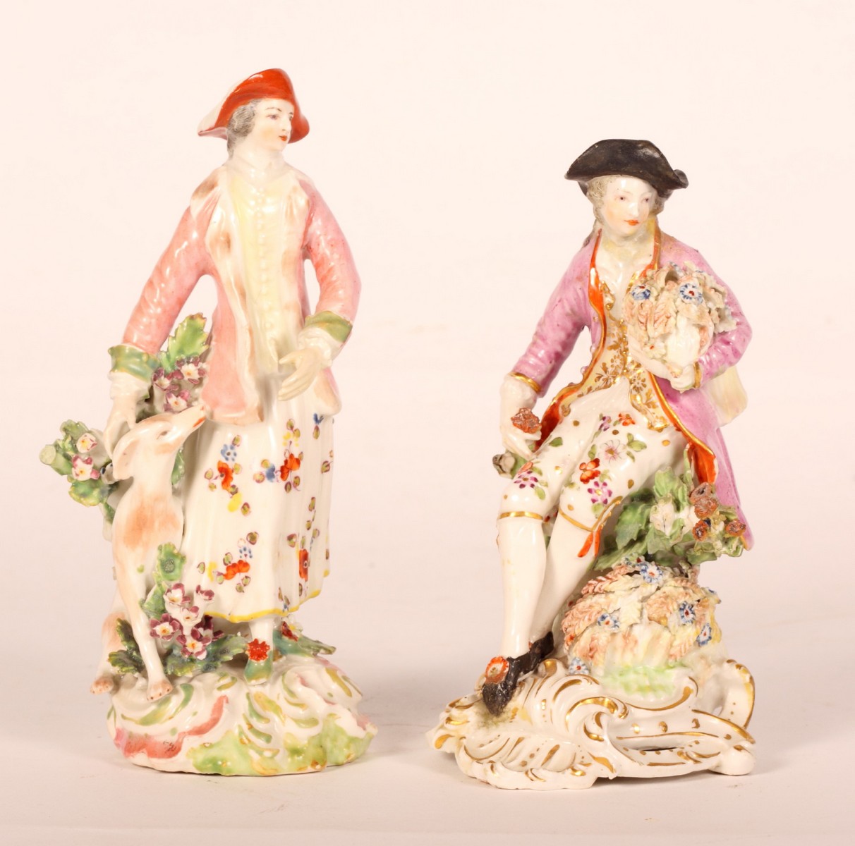 An 18th Century Derby figure of a woman with a greyhound, 7"" high (restored), and an 18th Century