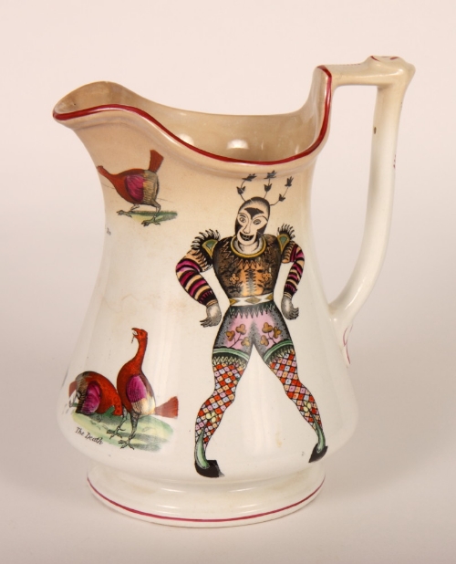 An Elsmore & Forster puzzle jug decorated Cashmore clowns and three cock fighting scenes (staining