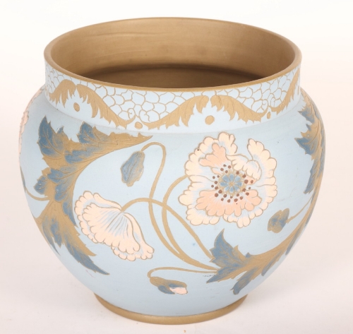 A late 19th Century stoneware jardinière with stylised poppies design on a blue ground, 8"" high