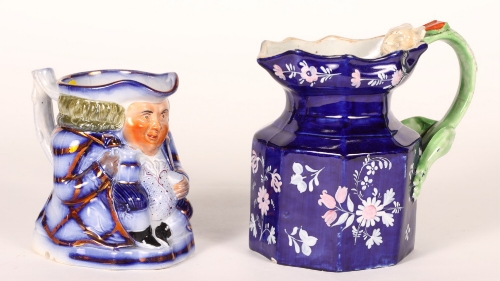 A 19th Century lustre decorated Toby jug, 5 1/2"" high, and an ironstone floral decorated jug with