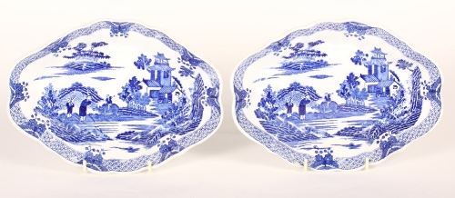 A pair of late 18th Century pearl ware lozenge-shaped dishes with boy on buffalo pattern, 10"" wide