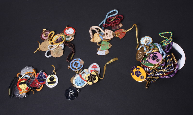 A large collection of enamelled horse racing badges for Newbury, Ascot and Kempton Park, and a