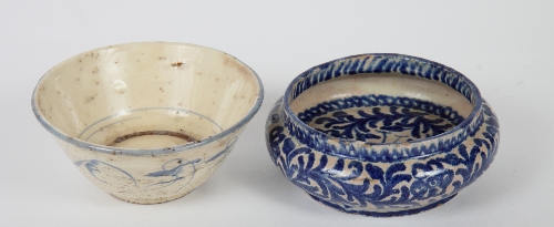 A Chinese provincial bowl with straight sides decorated plants and a shallow blue and white bowl