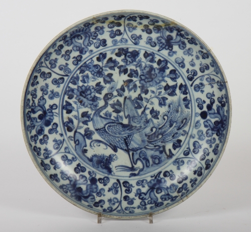A Ming porcelain shallow dish decorated floral painted border and central panel of a peacock, 12"