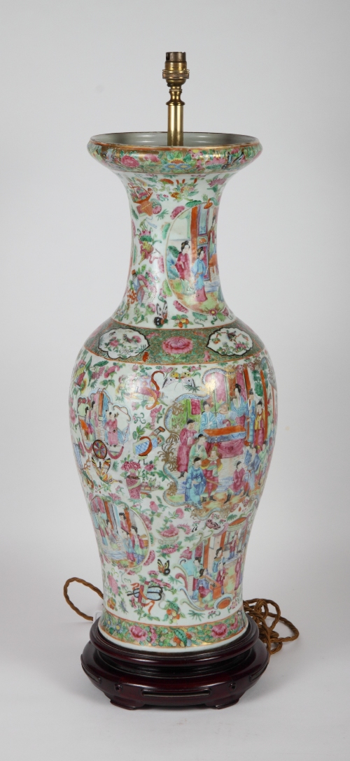 A 19th Century Chinese Canton famille verte vase profusely decorated with panels of figures, 24"