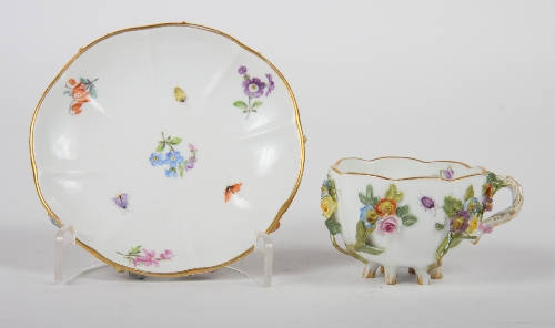 A Meissen cabinet cup and saucer with floral encrusted decoration
