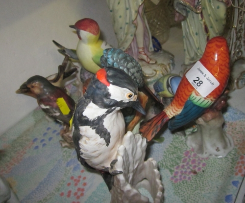 A Royal Worcester bone china woodpecker, a Goebel woodpecker and a number of other Goebel and