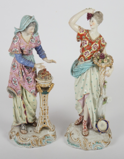 A pair of 18th Century Derby figures, Autumn and Winter, 14" high, on rock work bases (slight