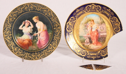 Two 19th Century "Vienna" gilt and figure decorated plates inscribed "Rosenzeit" and "Der bist mein"