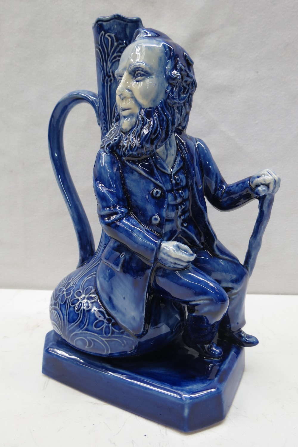 A Peggy Davies ceramics figural jug depicting James Macintyre in rare blue colourway, 23cm