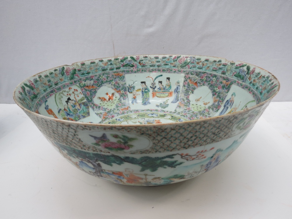 A fine Chinese 19thC enamel large bowl of famille rose influence, profusely decorated with scenes