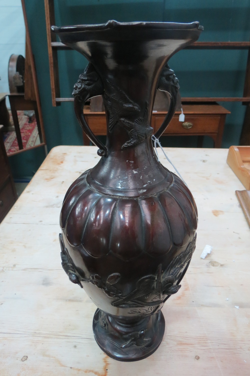 A bronzed metal vase with oriental influenced design; overall height 41.5cm.