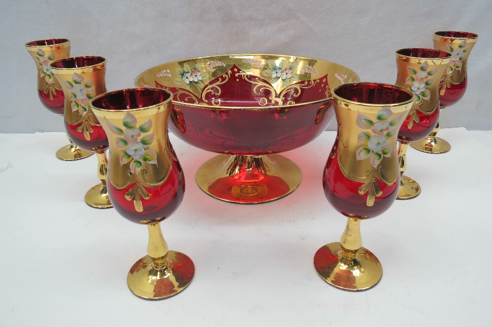 A Venetian glass gilded and hand painted pedestal bowl, 23 x 13cm, together with six matching