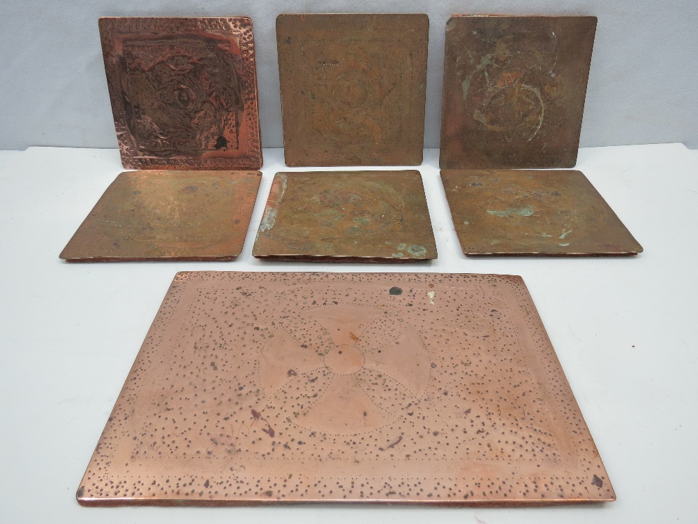 Copper table mats, hand made (? in evening class), first half of 20thC, each one bears a different