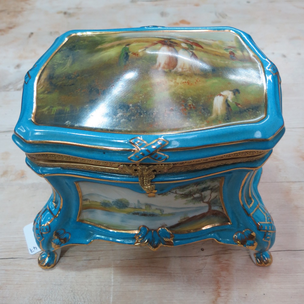 A reproduction, porcelain casket in the style of Sevres; 15cm high,  19cm wide,13cm deep.