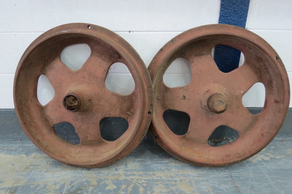 A pair of original vintage cast iron standard Fordson front wheels each measuring 78cm (31 inches)