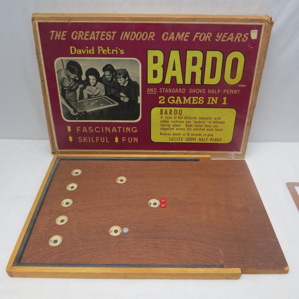 A board for the game of ``Bardo and Sussex Shove Half-Penny`` as retailed by Harrods, within