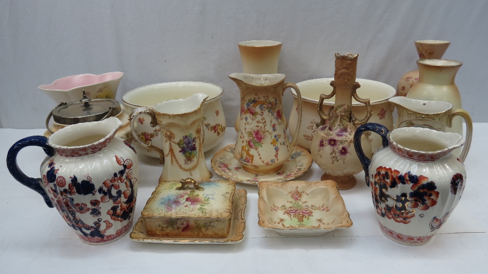 A collection of Crown Devon Ware including a biscuit barrel with E.P.N.S lid and mount, five vases,