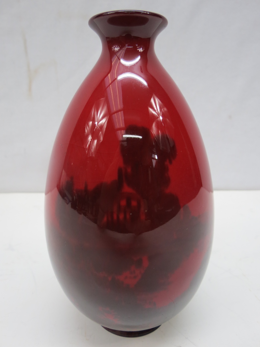 An early Doulton flambe scenic vase signed Noke, 15cm high