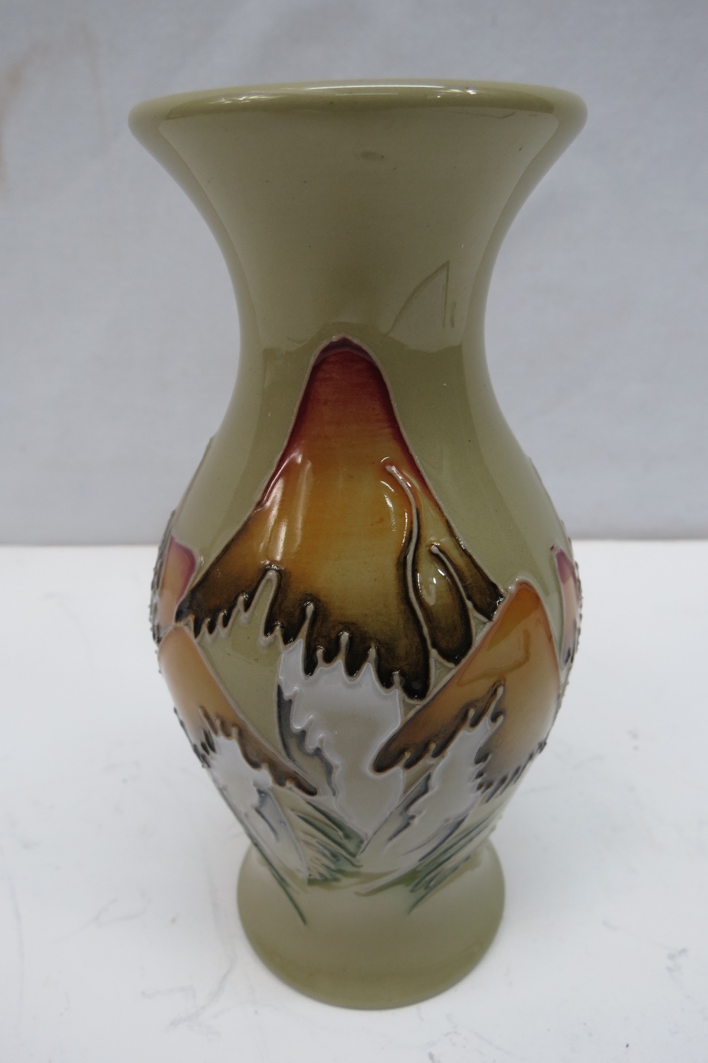 A Moorcroft vase with Toadstool design, 13cm high.