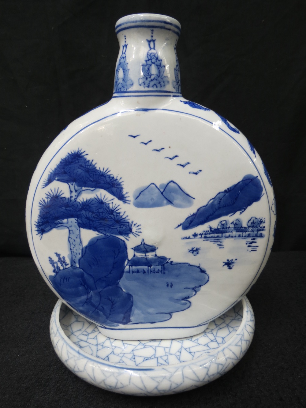 A large Chinese blue and white moon flask decorated with pagodas in landscape, 26cm, together with