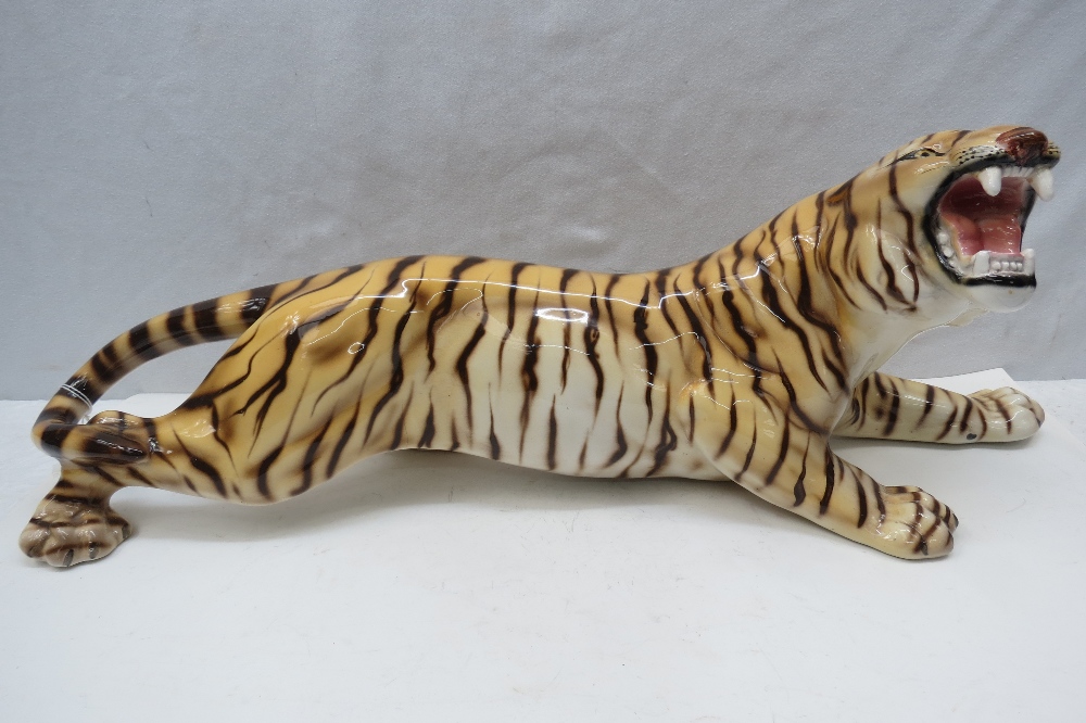 A very large ceramic figure of a snarling tiger, 62cm.