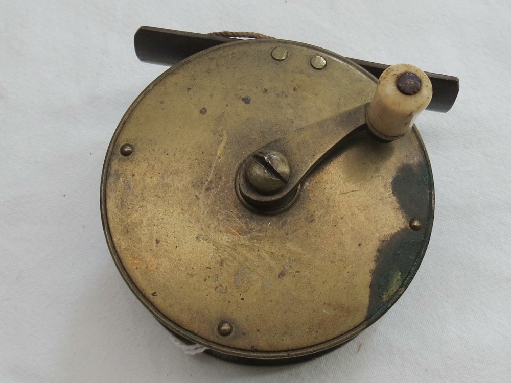 A vintage brass 2 1/2"winch with no maker's name and bone handle.