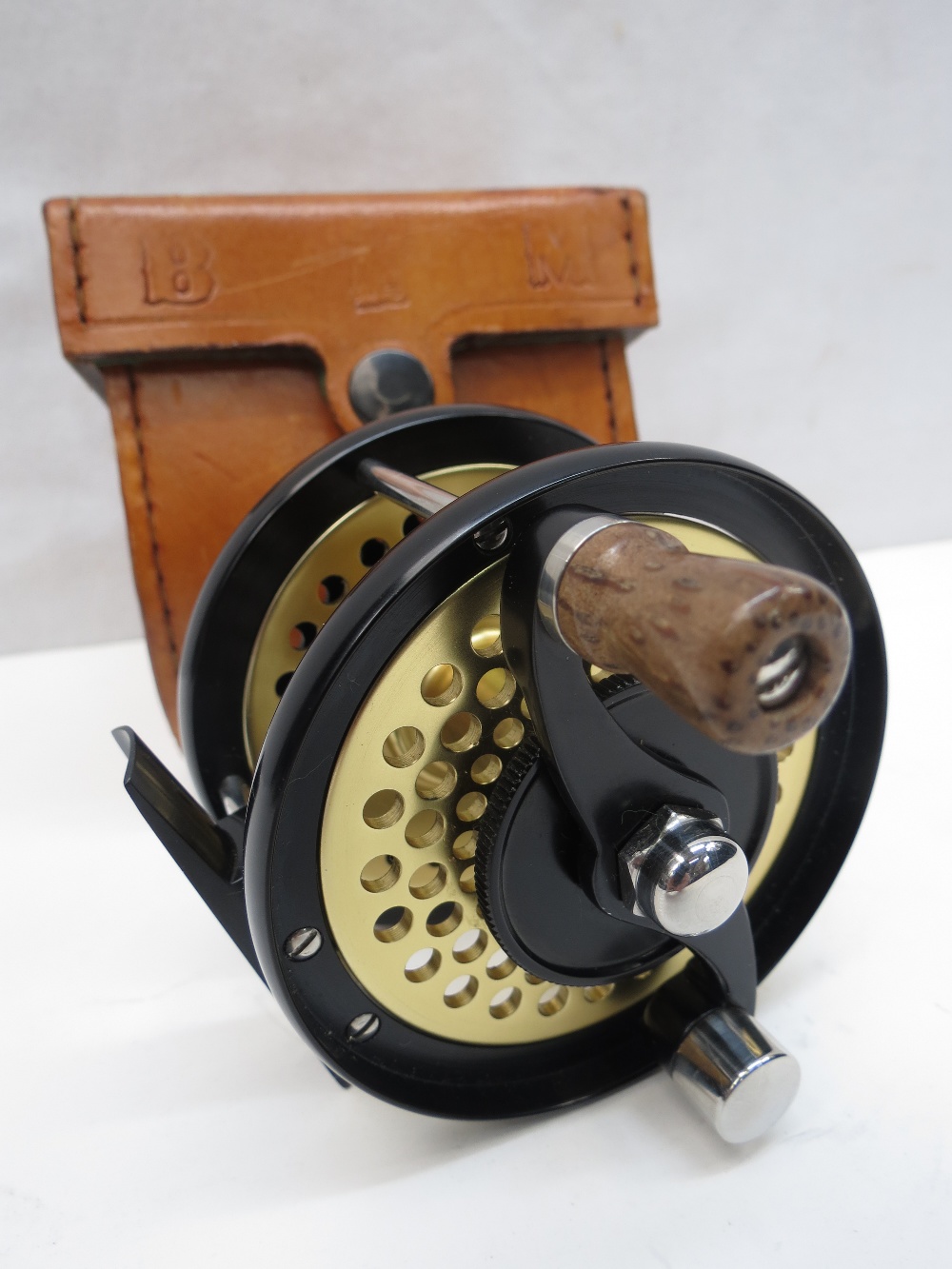 A Bo Mohlin LHW, 3 1/4"reel with perforated barrel and fitted leather case.