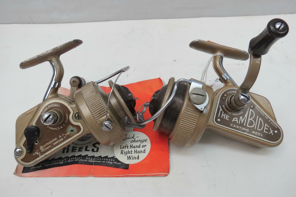 A vintage pair of J.W. Young & Sons 'AMBIDEX' spinning reels together with original manual.