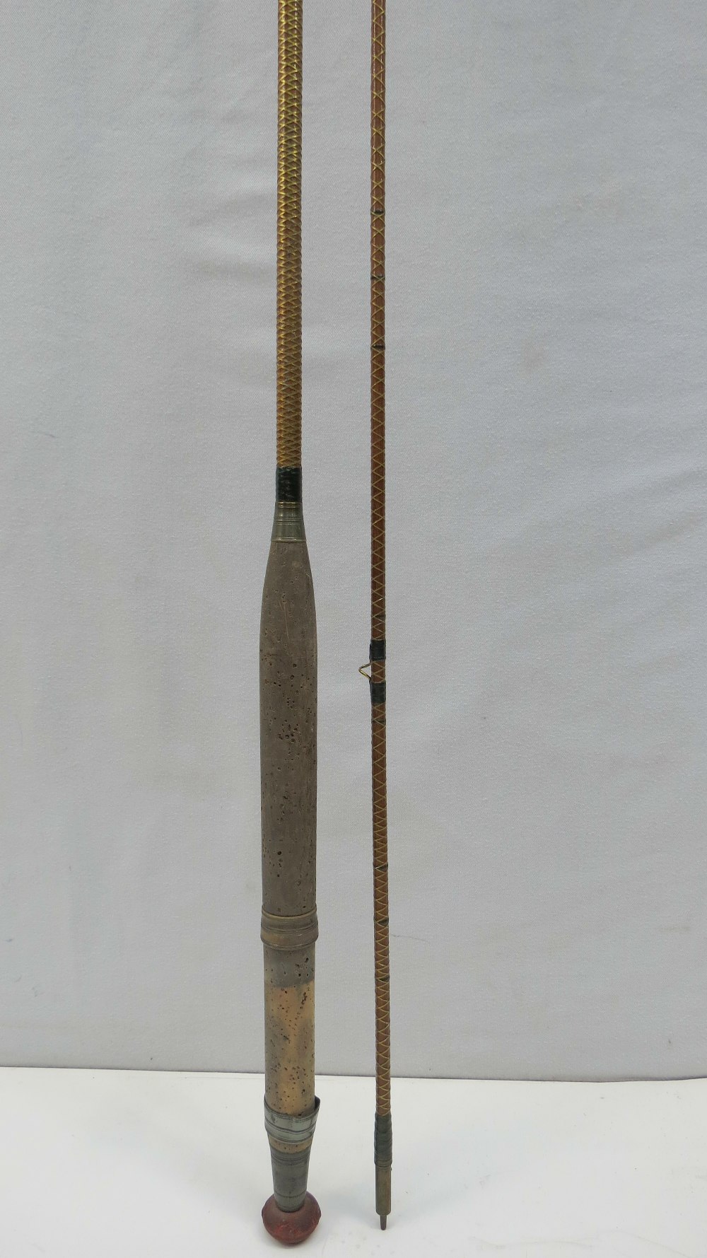 A vintage Foster Bros spilt cane, two piece, wire bound, fly fishing rod with original wooden