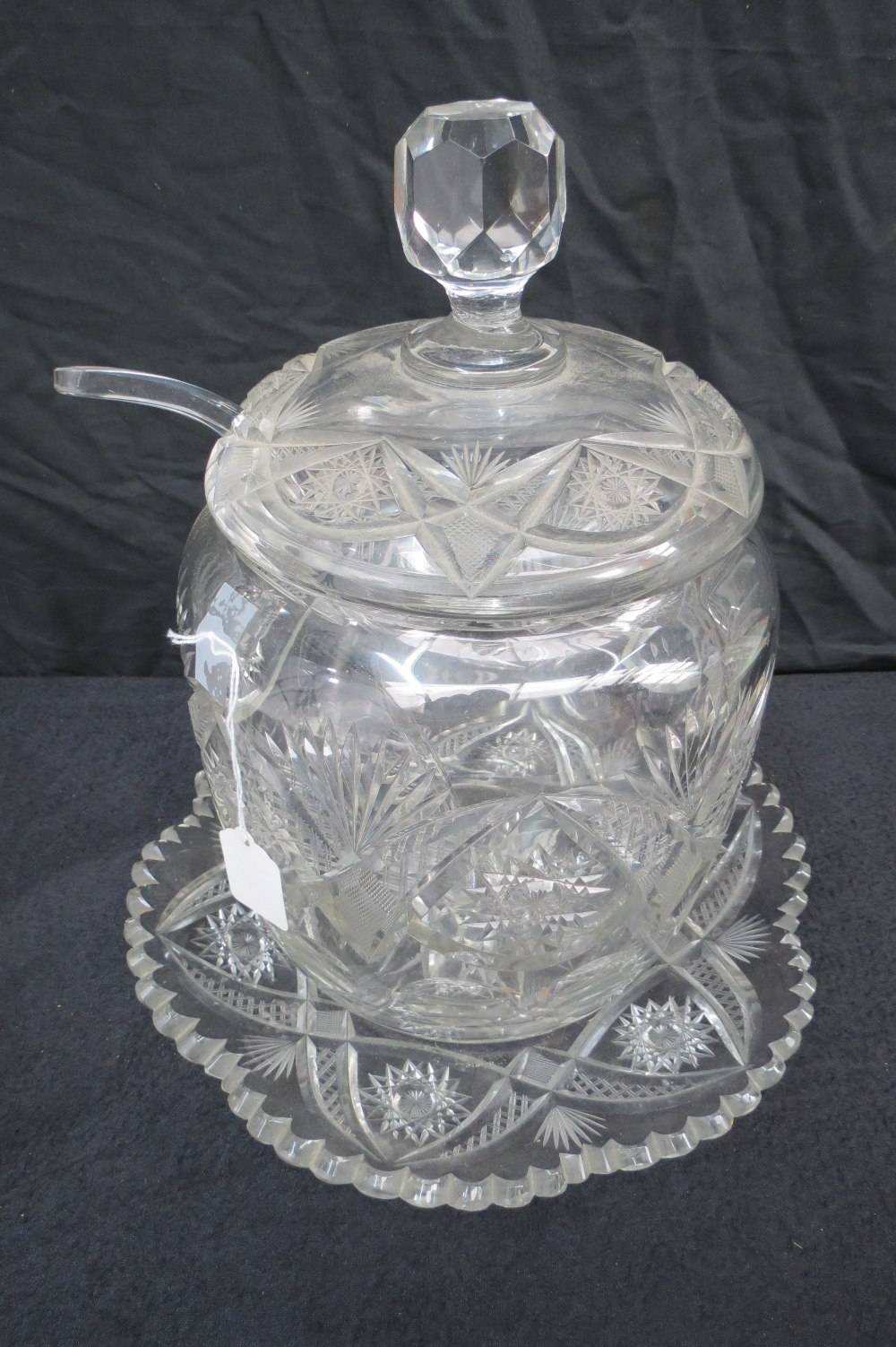 A fine quality crystal glass lidded punch bowl, complete with associated label and stand, 36cm