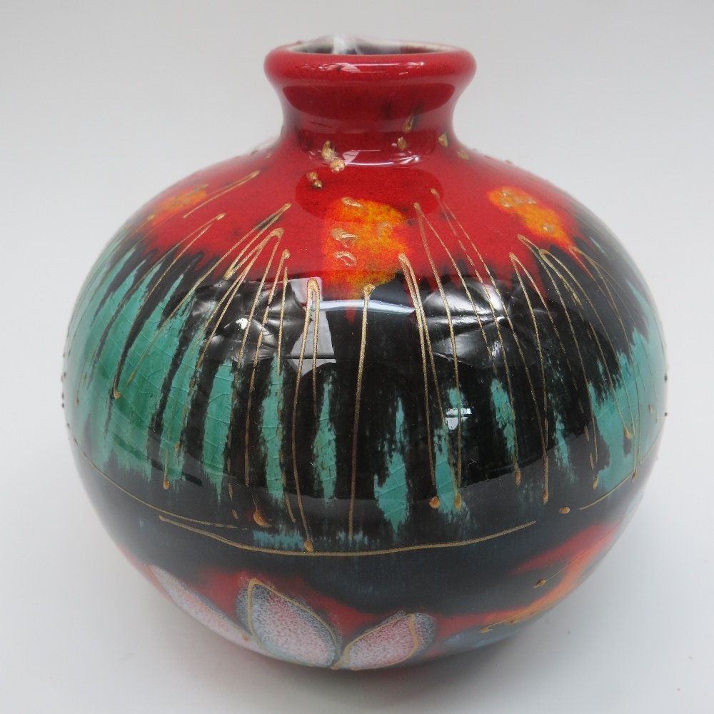 An Anita Harris studio pottery signed vase with water lily design.