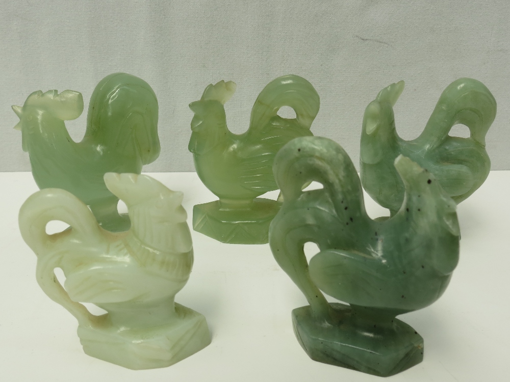 A 20thC carved jadeite cockerel, 9cm high together with four other similar.