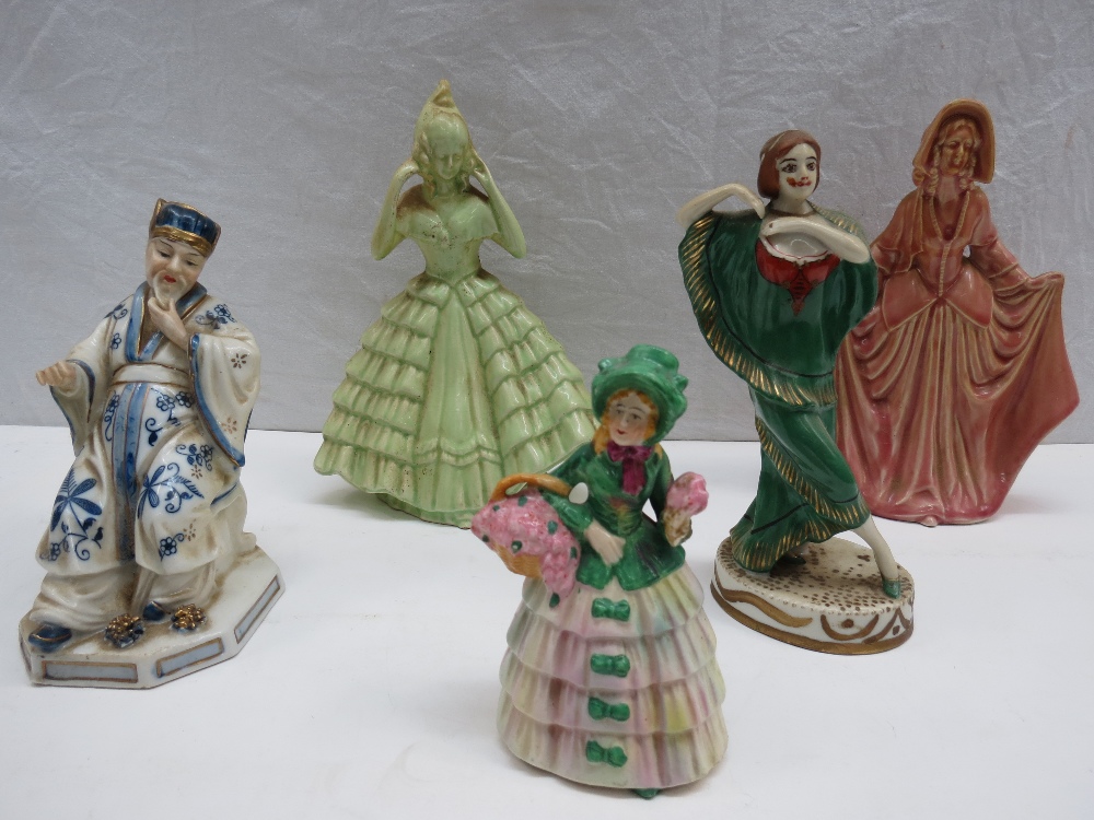 Five assorted handpainted ceramic figurines including early 20thC Japanese export `seated