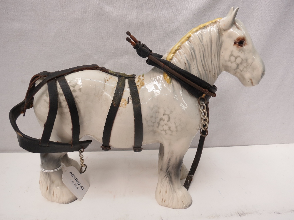 A Beswick grey shire horse with harness, 22cm