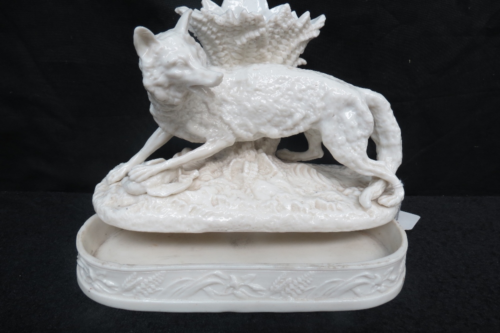 A late Victorian Creamware Spill Vase Fashioned as a Fox on a Lidded Base, 15cm x 21cm
