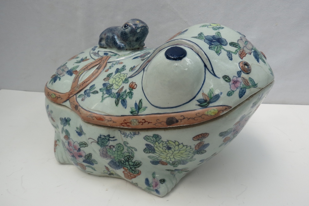 A large Chinese porcelain soup tureen in the form of a frog, decorated with flowers and insects and
