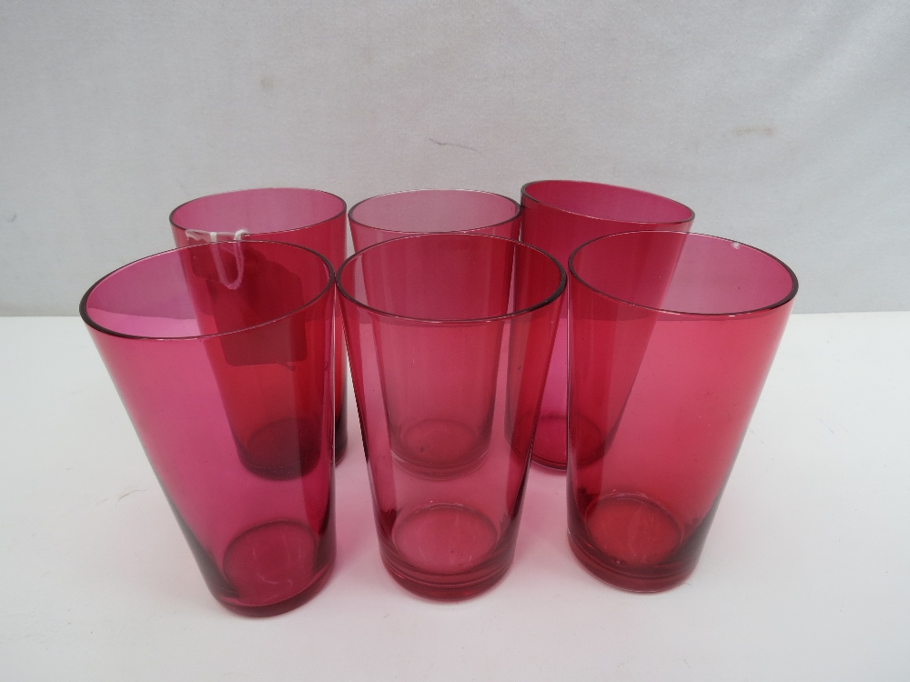 A set of six Victorian cranberry glasses, height 10cm
