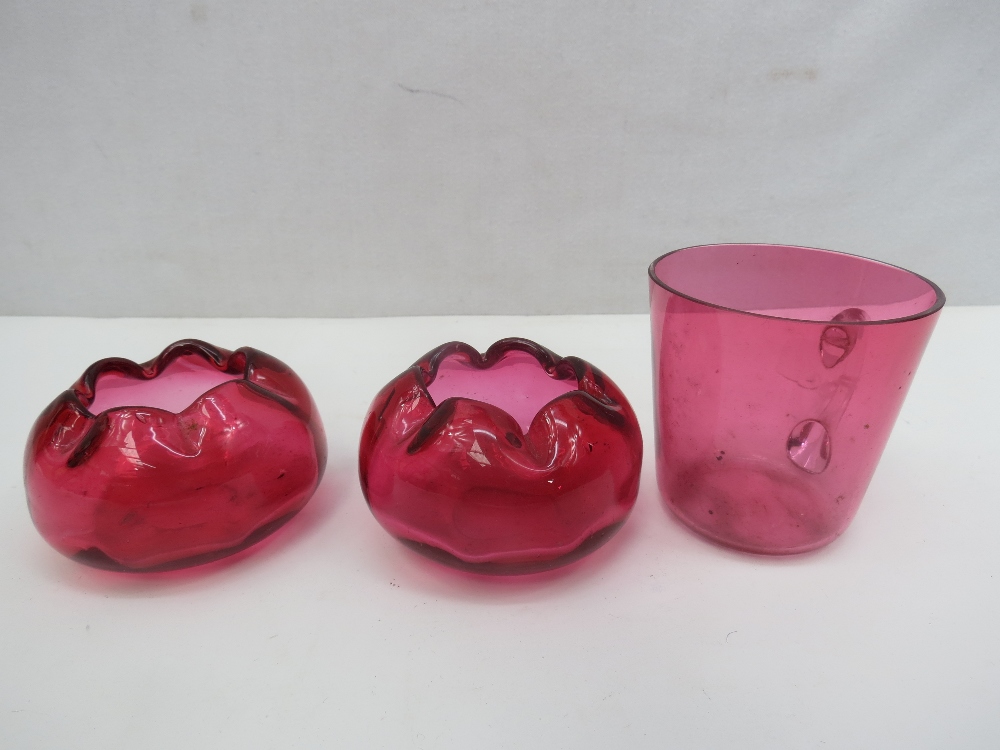 A pair of small Victorian cranberry glass vases, height 7cm and a cranberry glass custard cup,