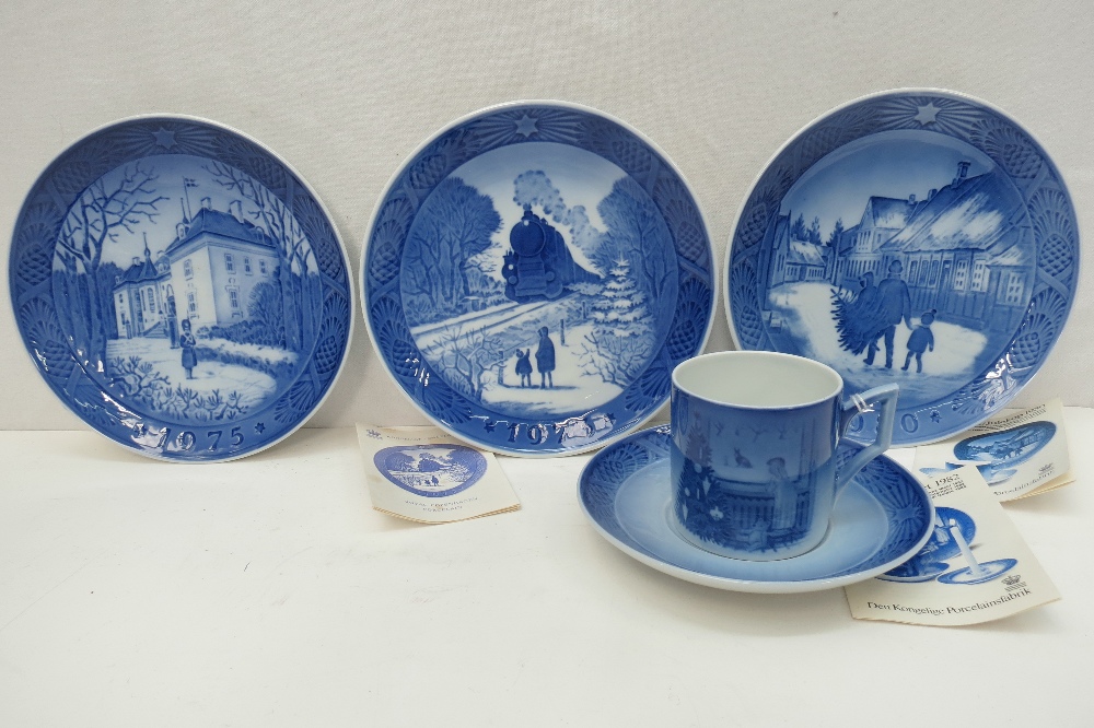 Royal Copenhagen Christmas plates, 1973, 1975 and 1980, also cup and saucer by Julestemming 'Waiting