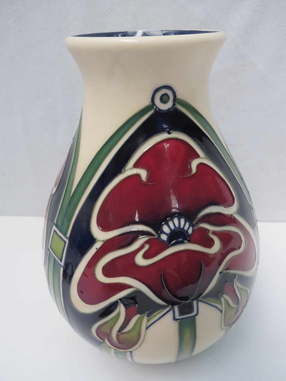 A large Moorcroft vase with petal dome design, Marked 'Trial' under with a red dot to base, height