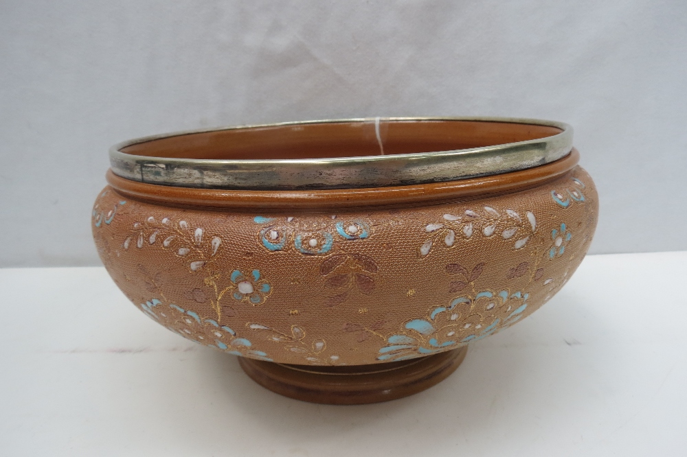 A large Doulton stoneware bowl with white metal rim, 26cm